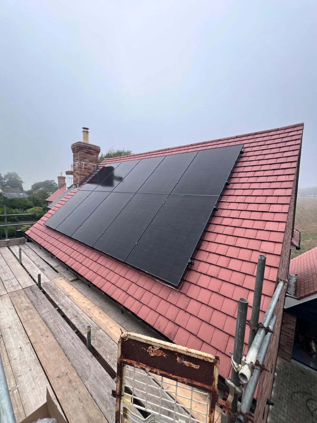 Real EnviroHomes all-black rooftop solar installation